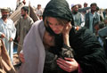 an old refugee woman thanking Jemima