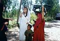 young girl and her brother collecting a tent